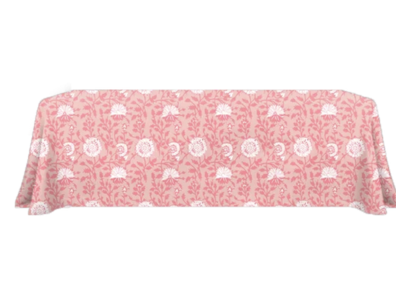 Georgia table linens, featuring a soft peachy background and an overlay of pink and white florals.